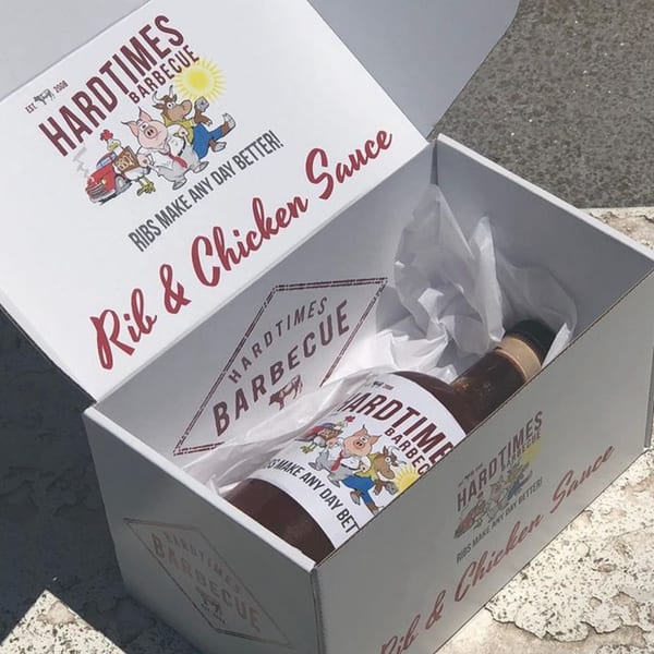 Hard Times BBQ Rib & Chicken Sauce in a branded box with a bottle of sauce inside.