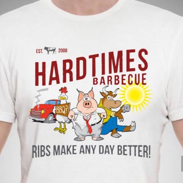 Hard Times Barbecue t-shirt with cartoon chicken, pig, and cow, and text "RIBS MAKE ANY DAY BETTER!"